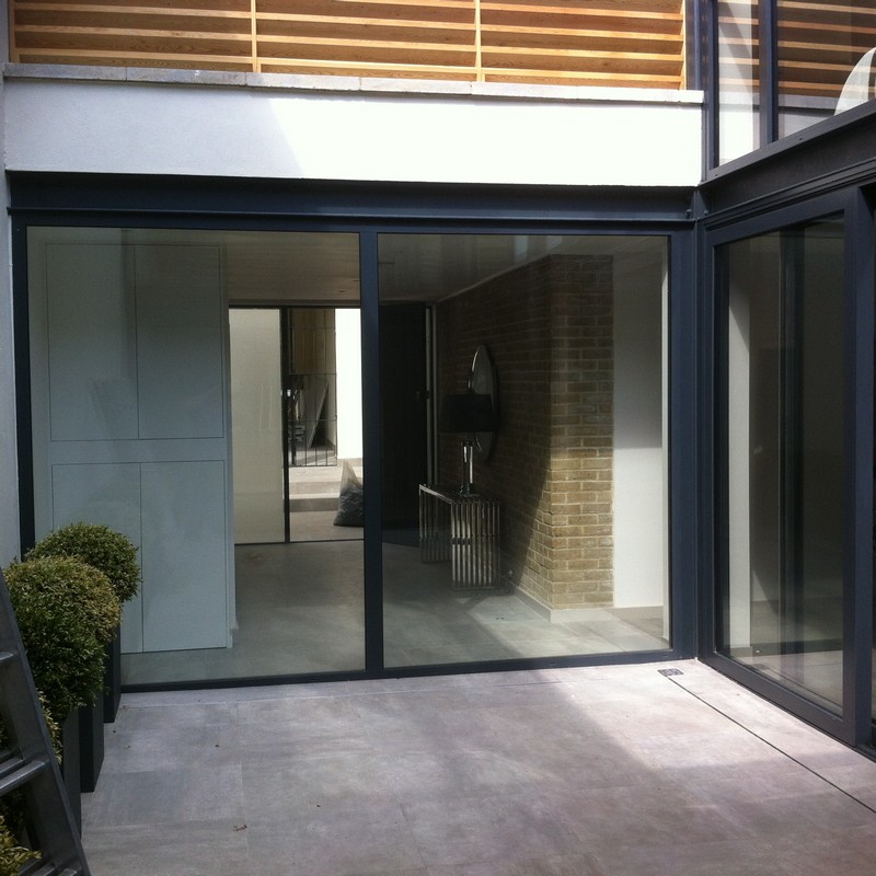 Floor-to-ceiling sliding doors opening to courtyard in Banbury