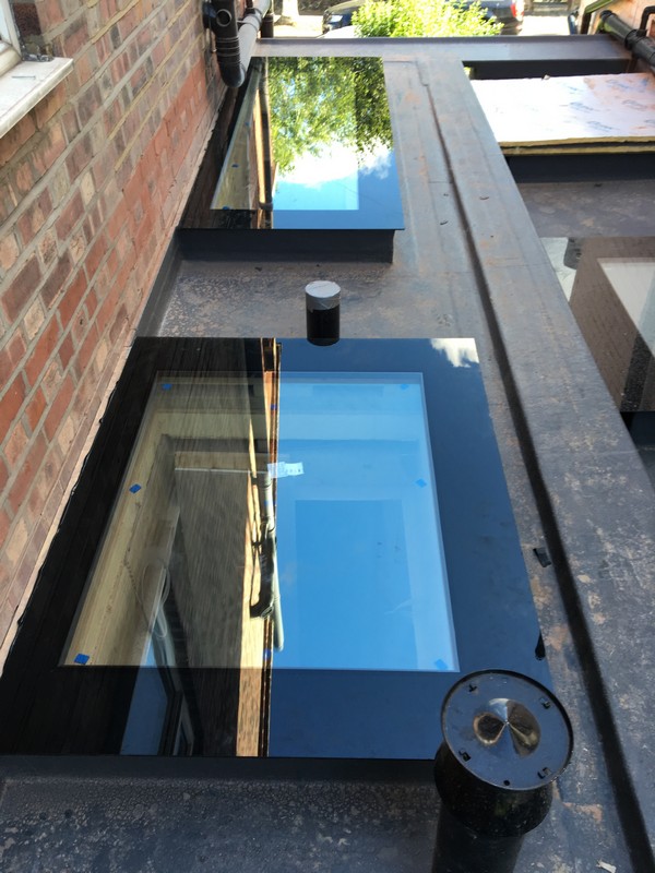Multiple flat roof skylights on extension in Banbury
