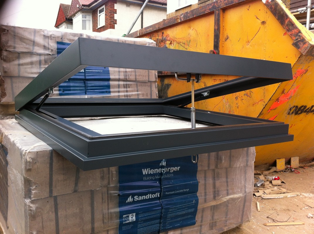 Opening flat roof skylight in anthracite grey installed in Banbury
